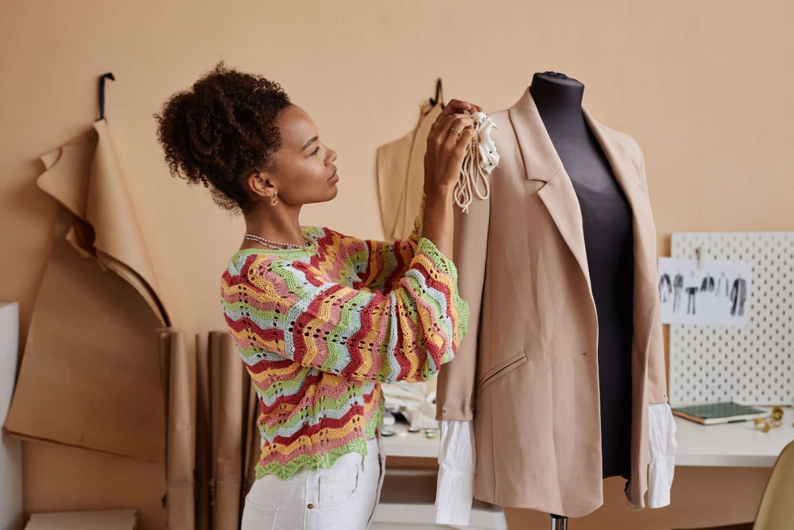 Seamstress working on a jacket.