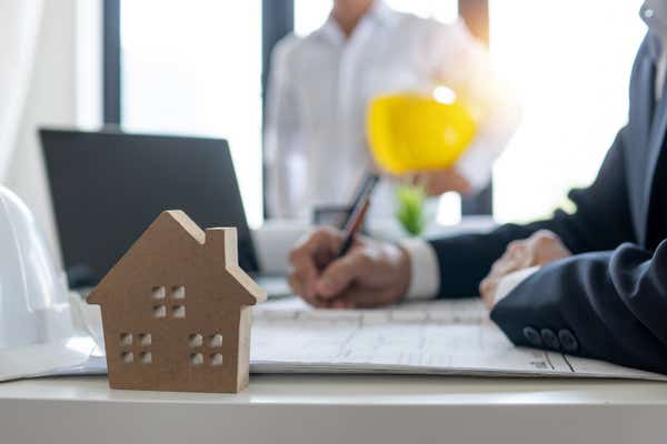 A landlord or estate agent signing a property contract