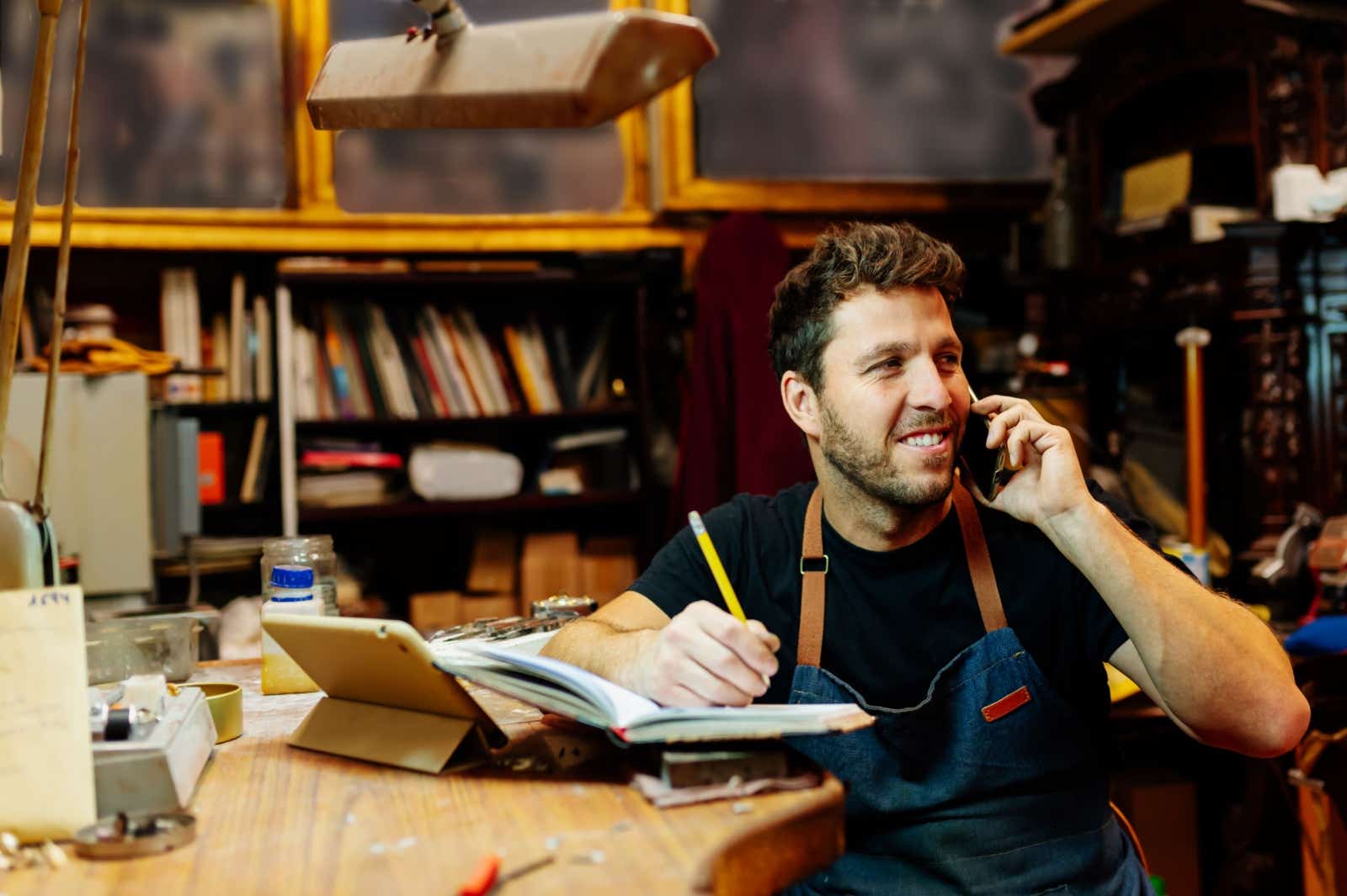 Craftsman in his office on the phone