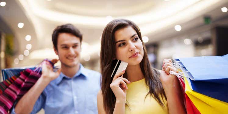 couple-shopping-with-credit-card-and-bags