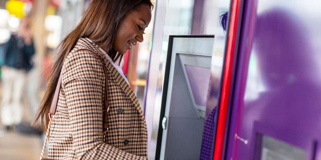A woman at a cash machine