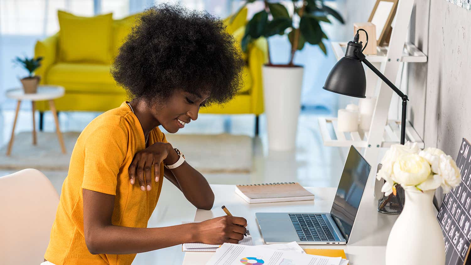 smiling female freelancer working at home