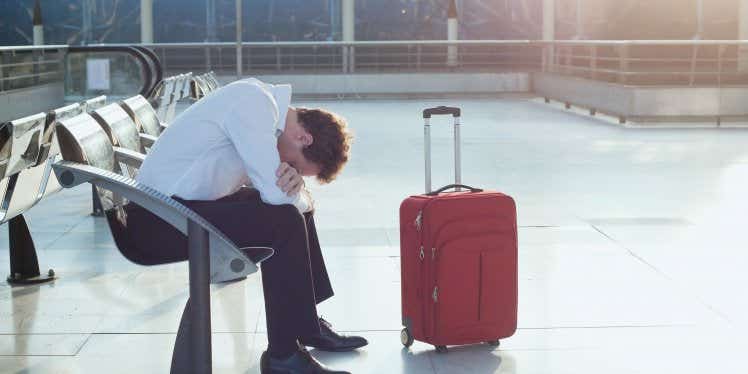 man-at-airport-upset