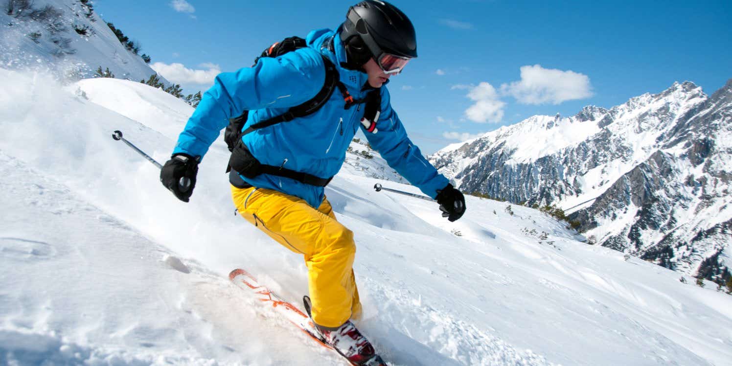 Man skiing down mountain slope