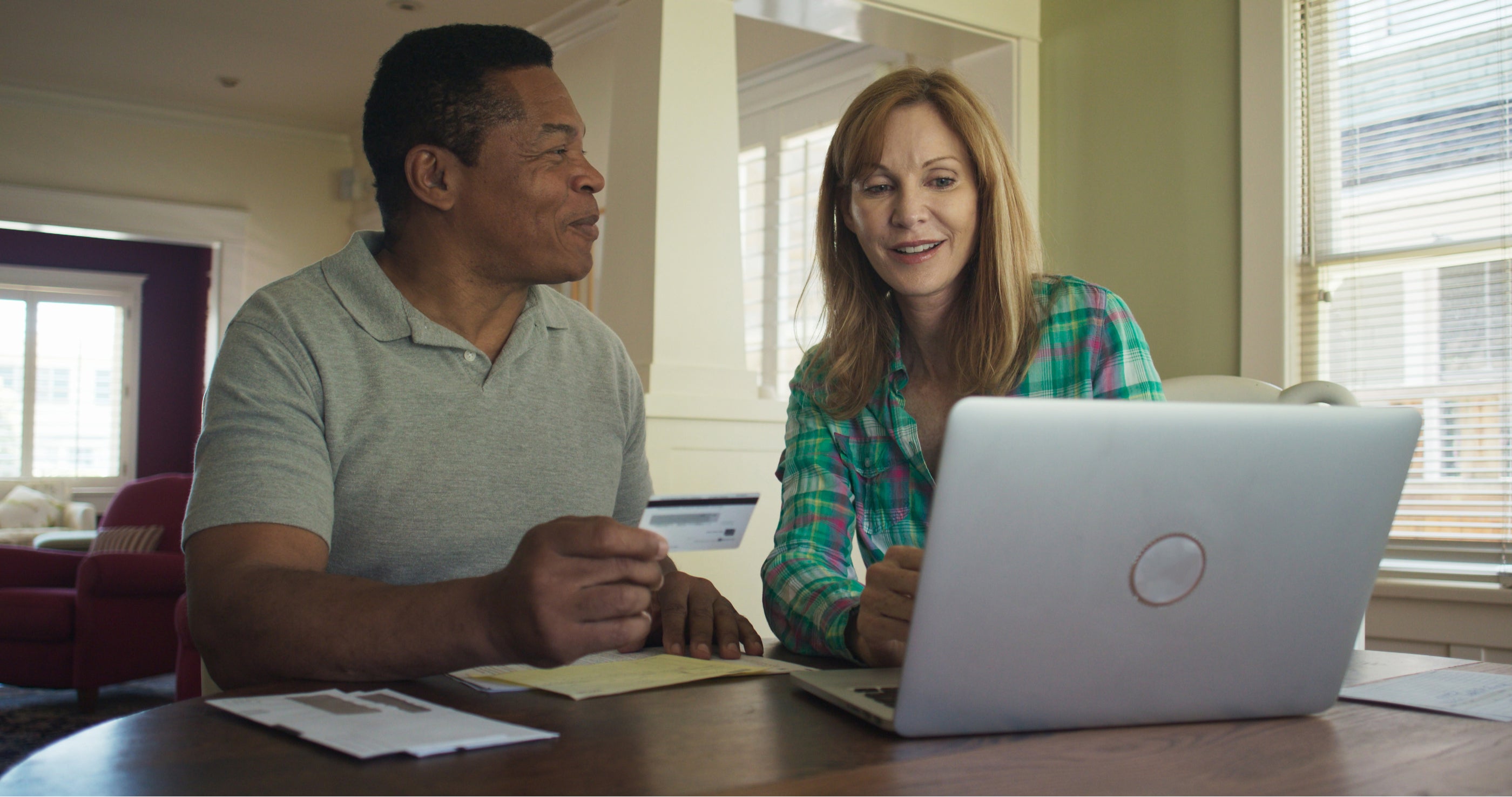 A couple looking at their loan balance