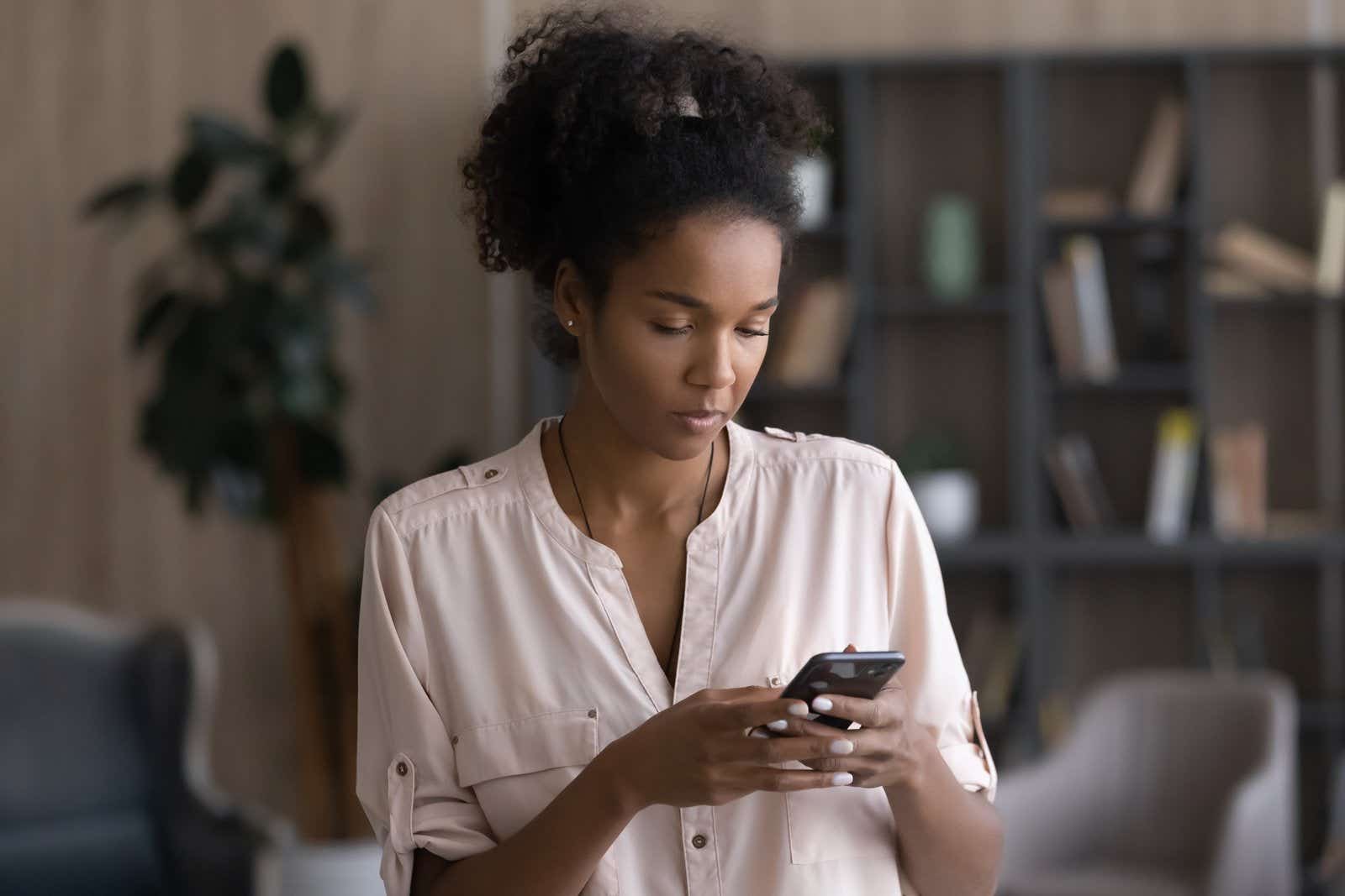 focused woman on phone