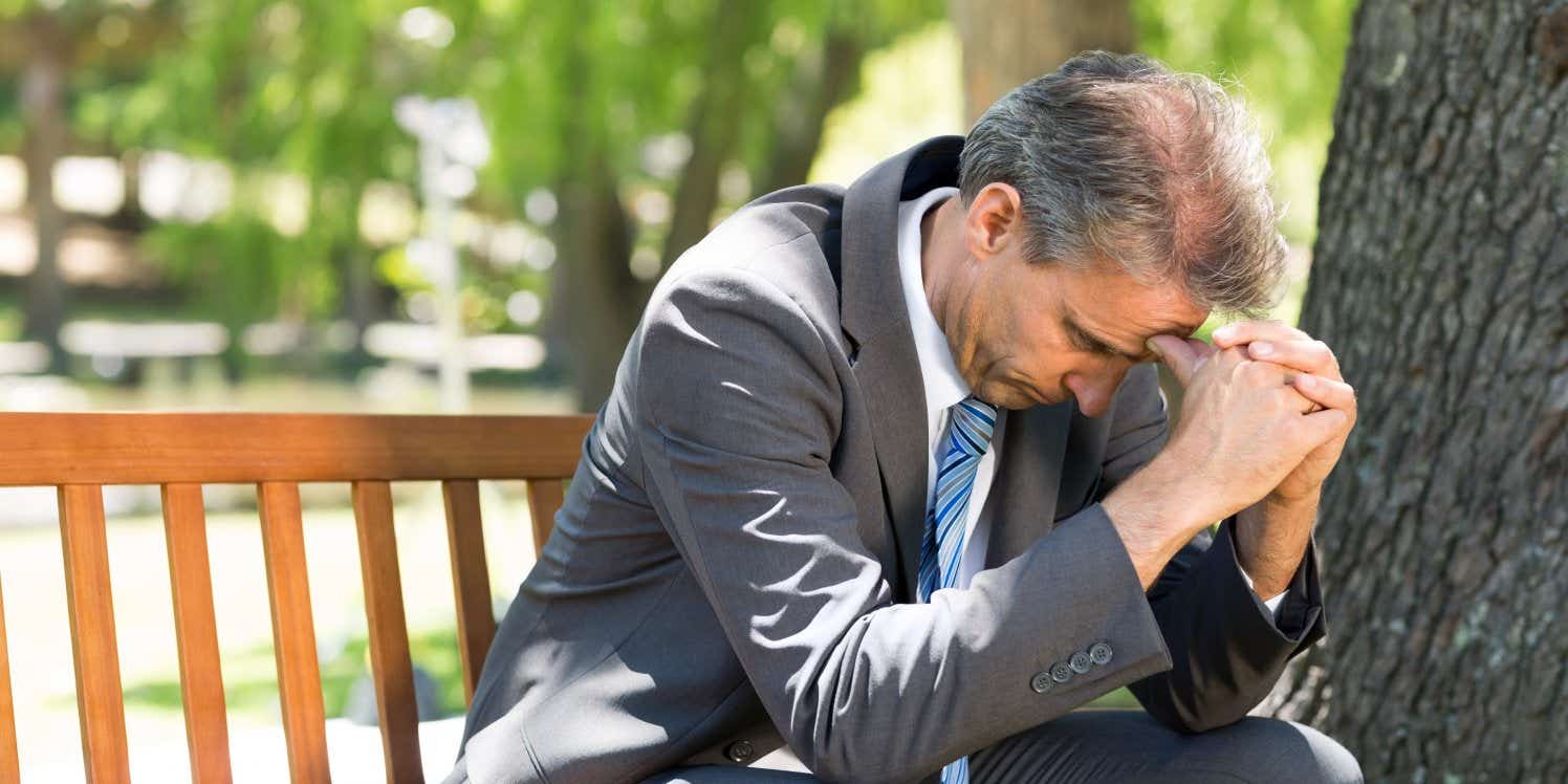 unhappy-businessman-in-park