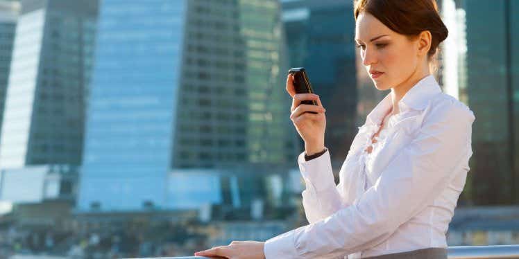 young-business-woman-looking-at-mobile