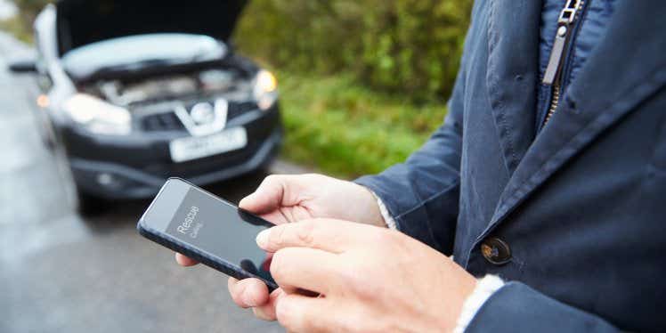 car-broken-down-man-on-phone