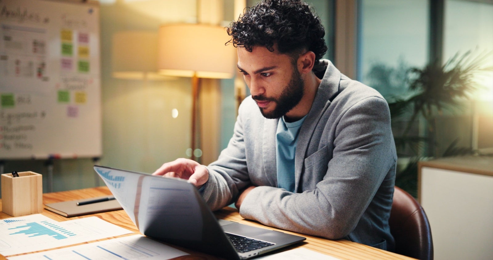 Businessman working on his laptop in the evening