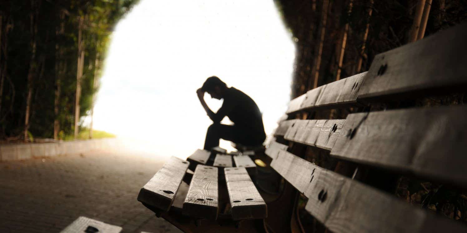 Depressed man on bench