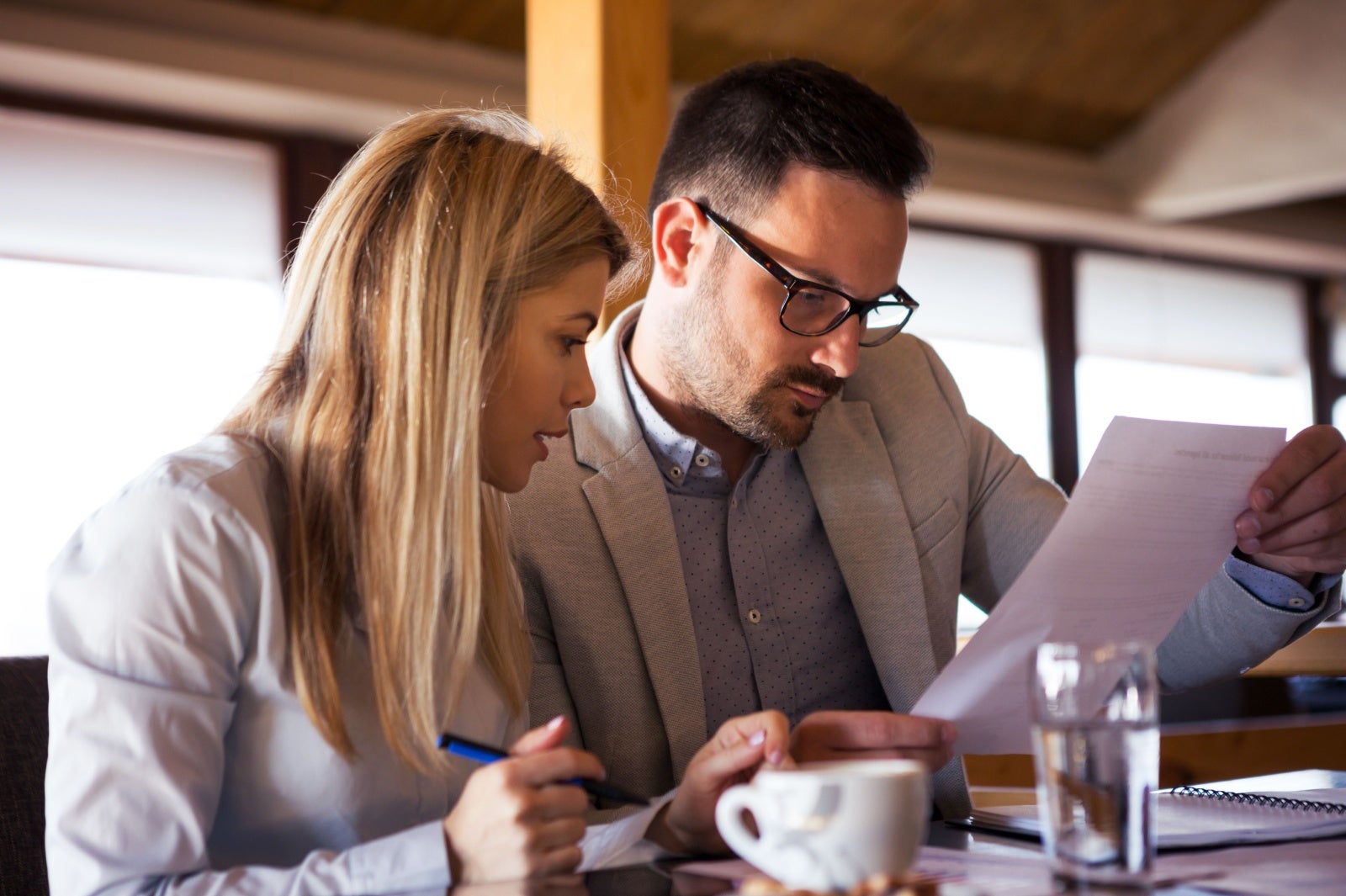 Business partners check their paperwork