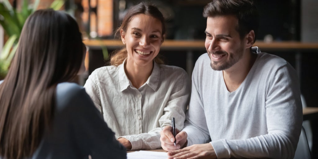 A couple talking to a loans adviser