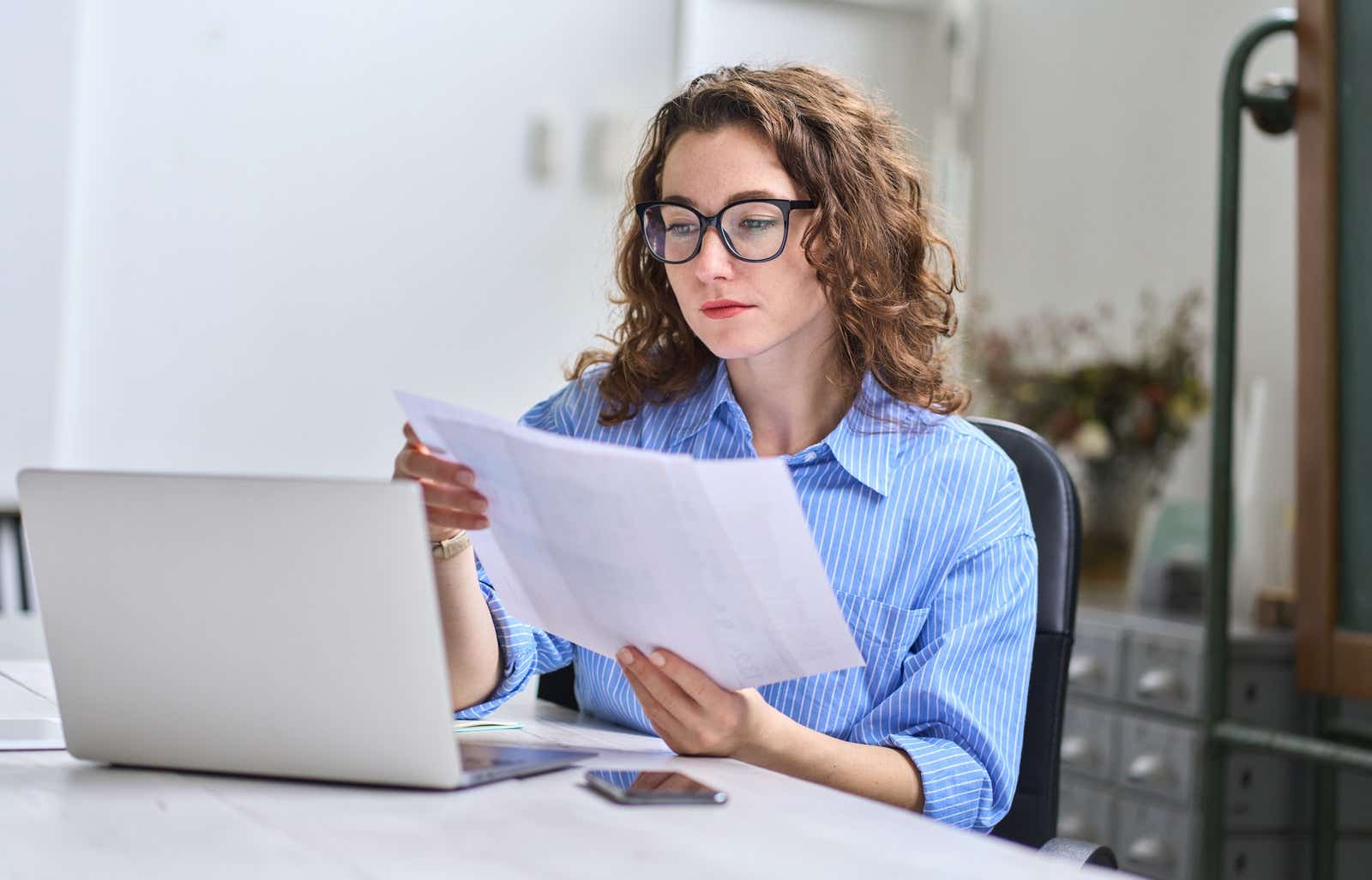 Young professional checking paperwork