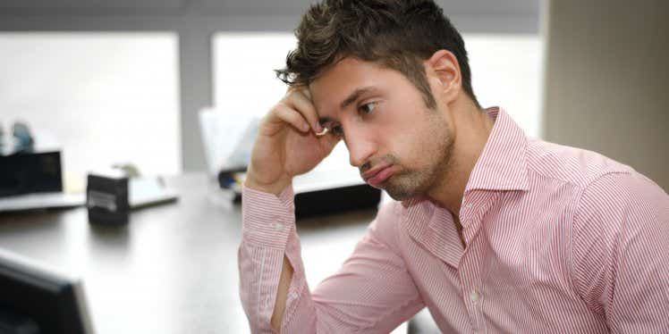 man-shirt-office-computer-unhappy