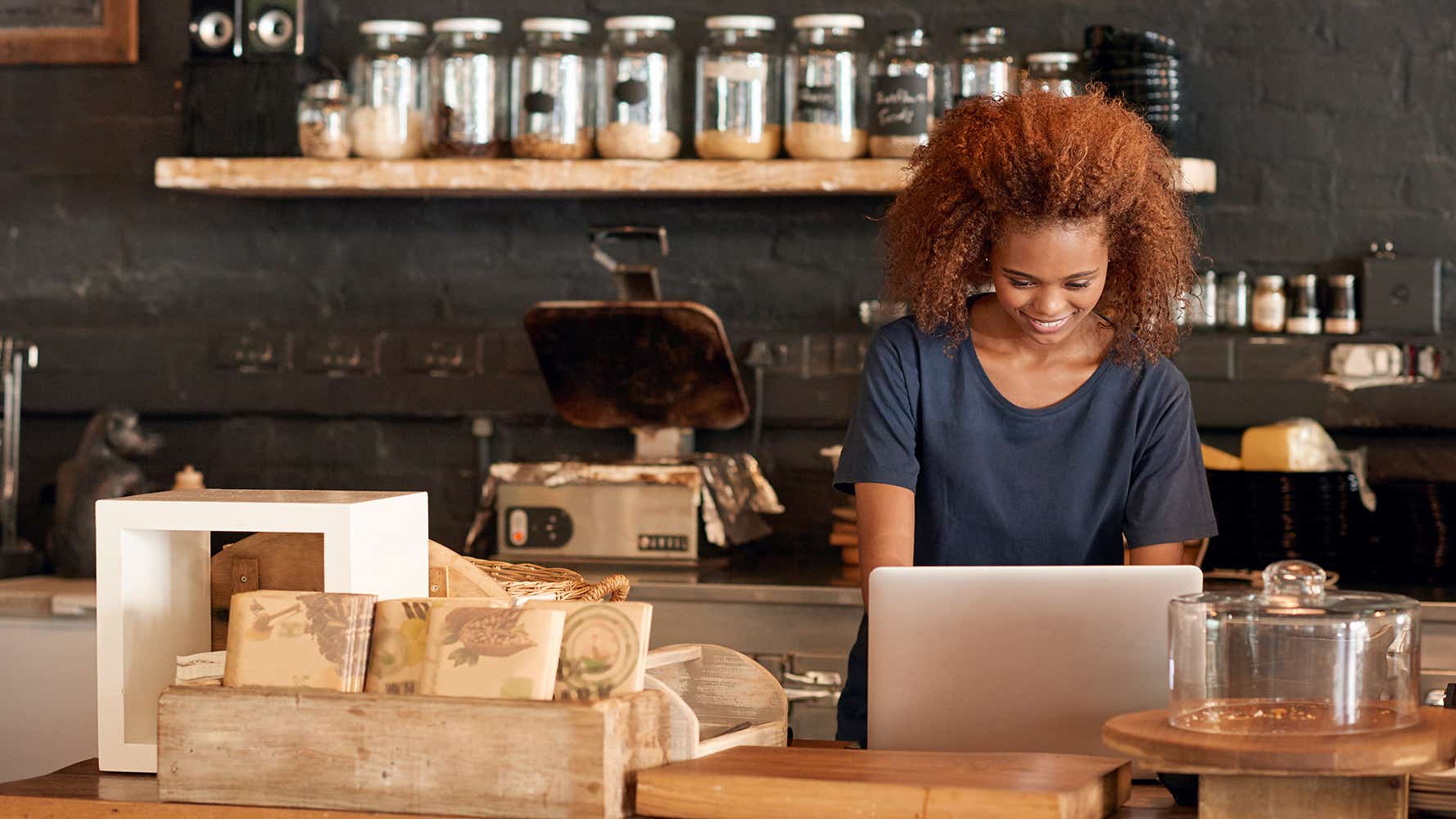 woman in cafe working on laptop