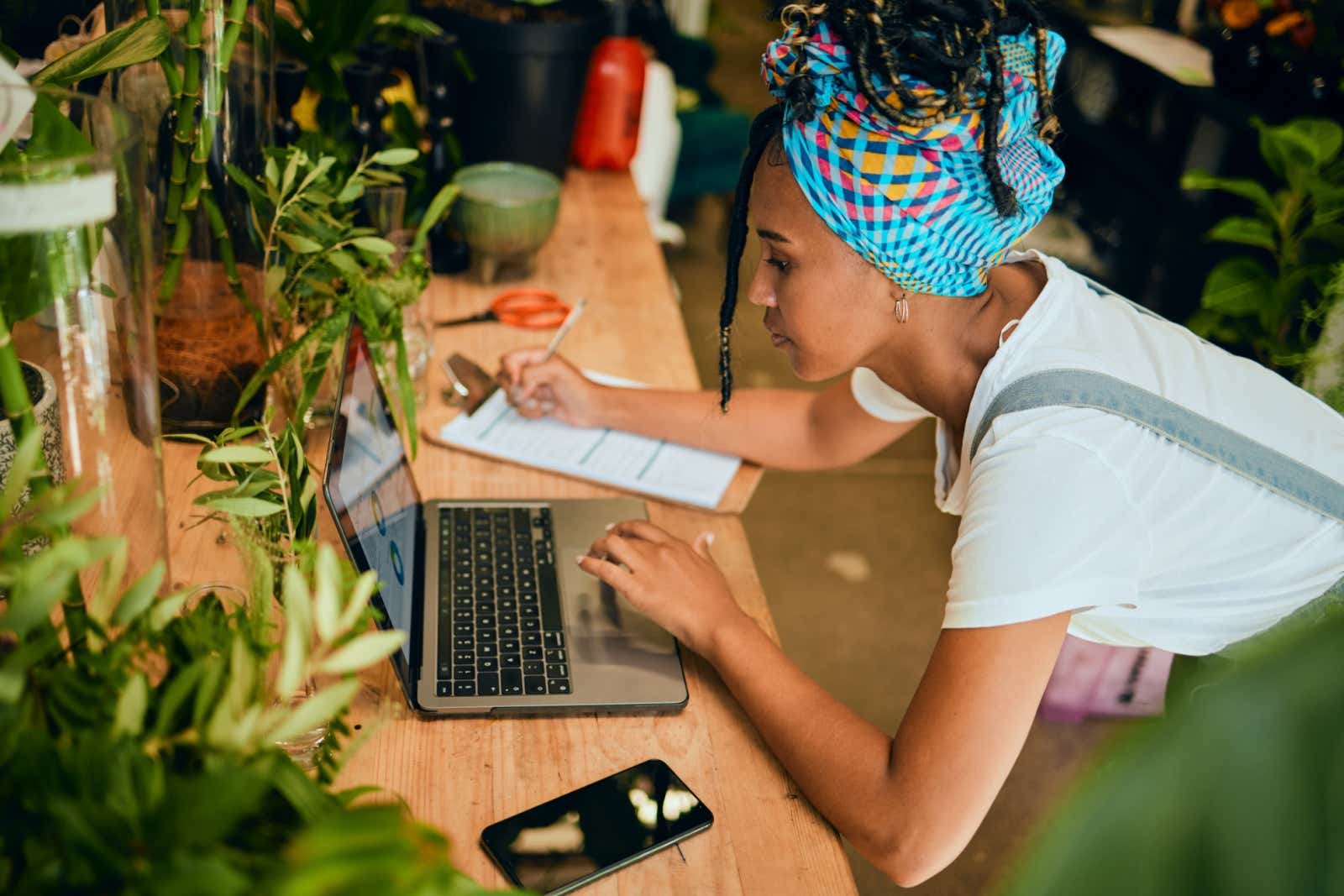 Florist reviews her options on a laptop.