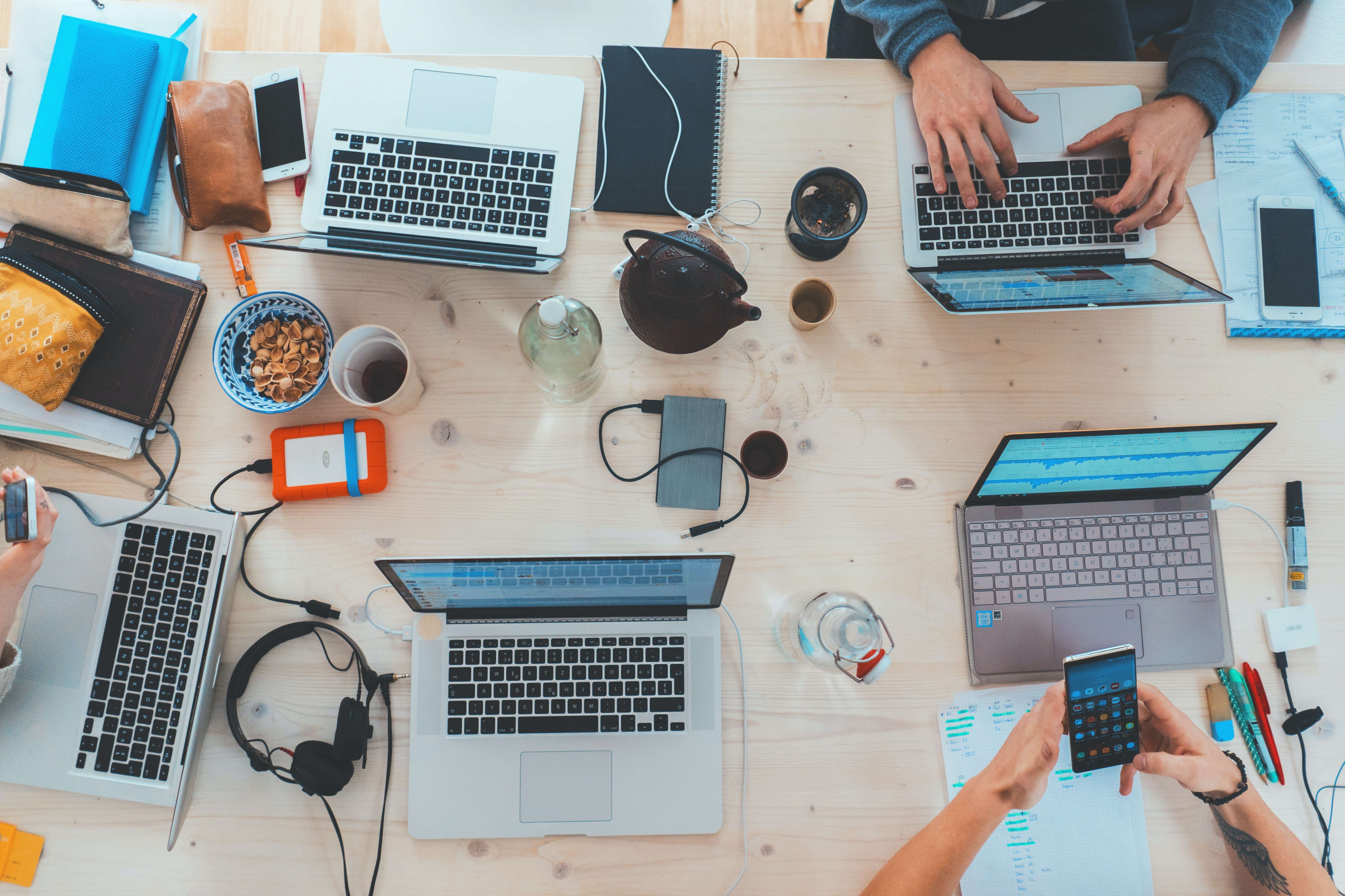 A table with laptops and phones 