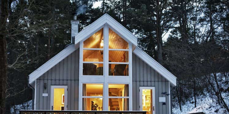 well-lit-house-surrounded-by-snow