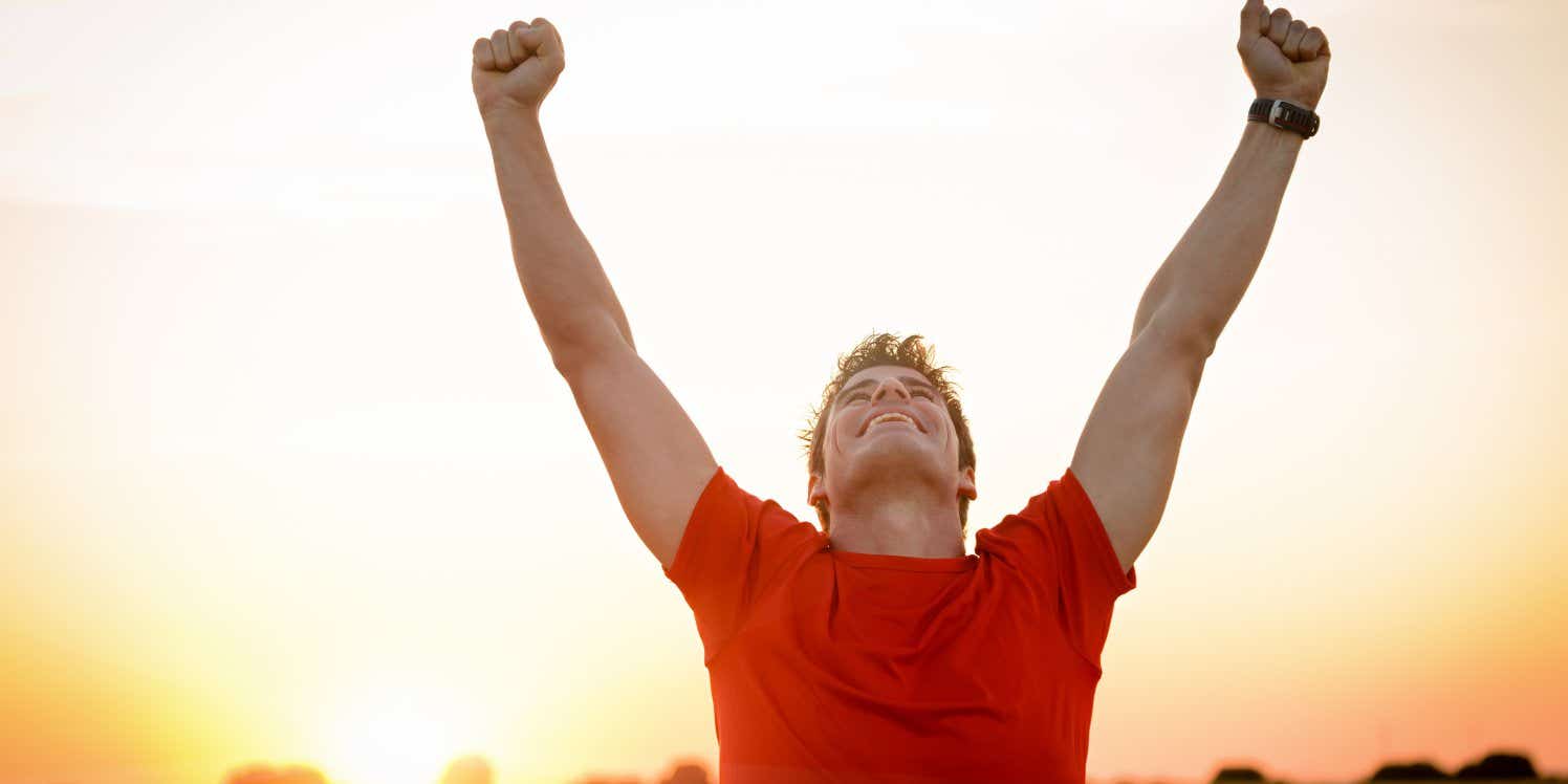 man-celebrating-winning-runner