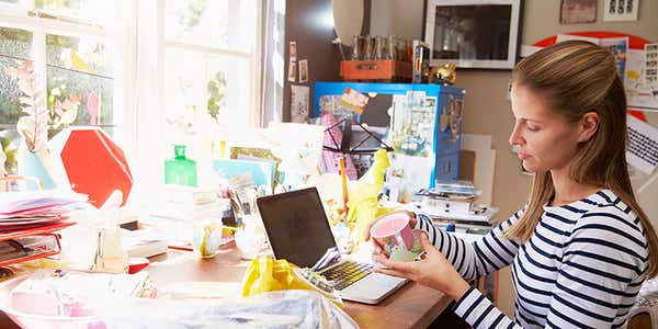woman home small business side hustle working