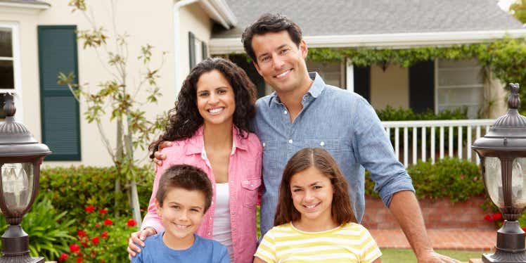 family-stood-outside-house