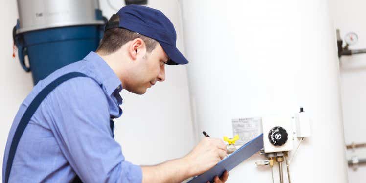 plumber-servicing-boiler