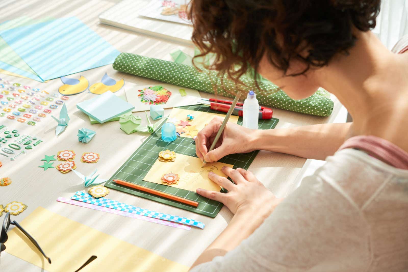 A woman creating handmade cards.