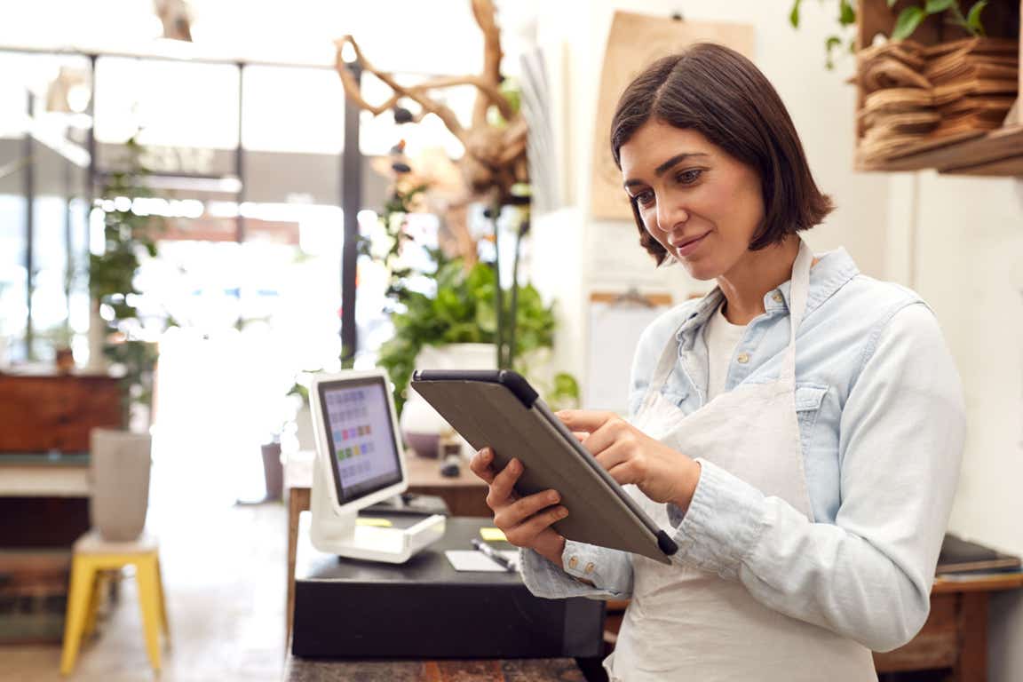 A business owner using a tablet as part of their day-to-day routine.