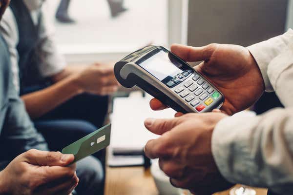 People using a card machine