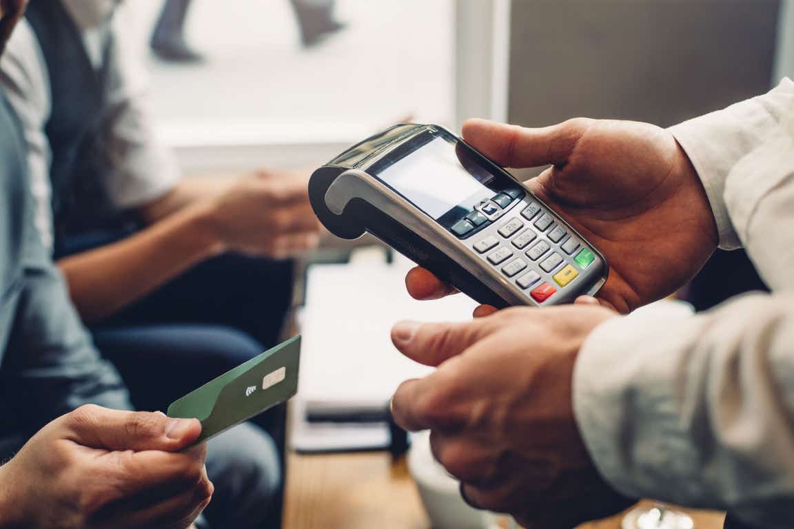 People using a card machine