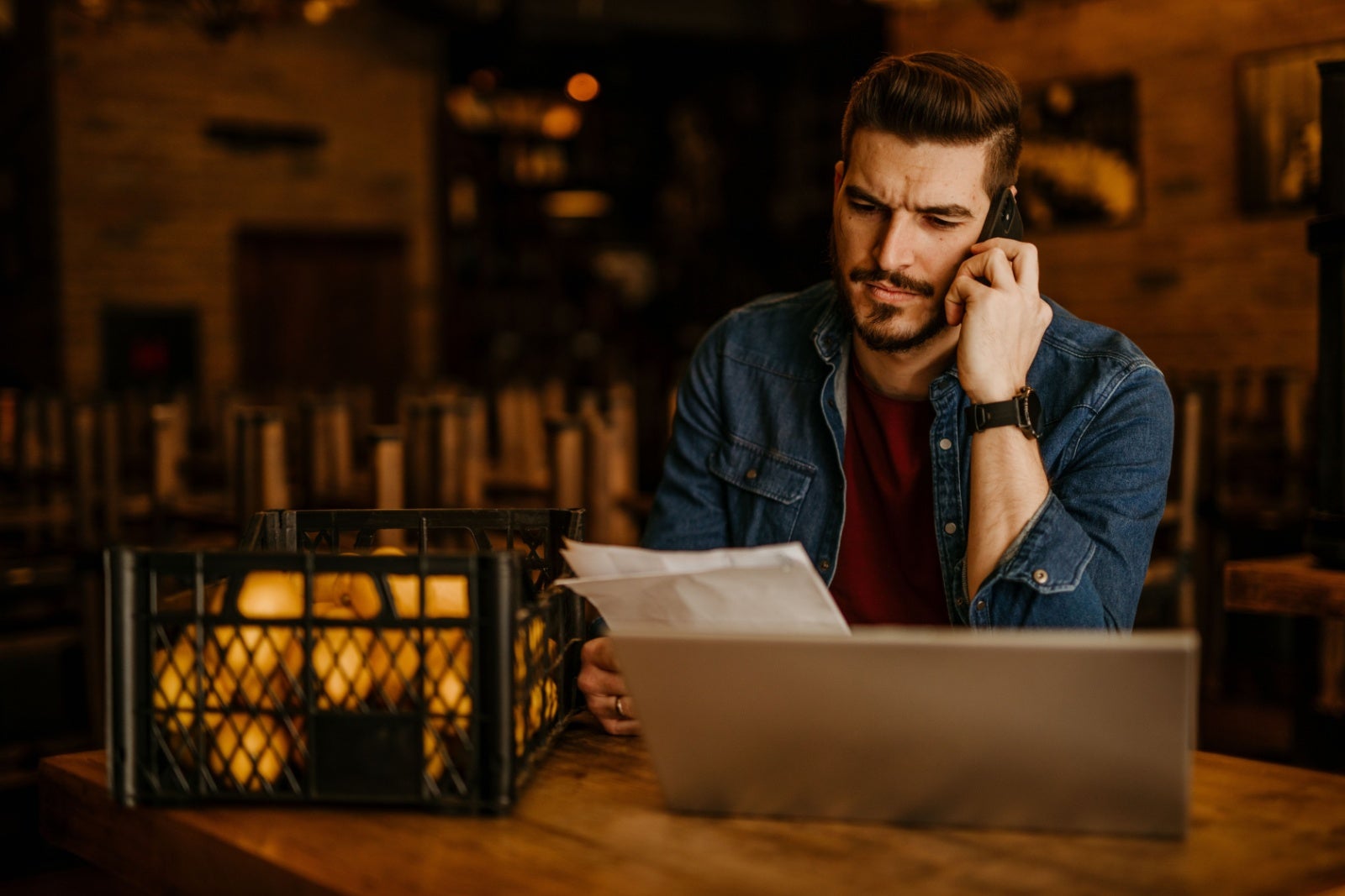 A businessman does his paperwork late at night. 