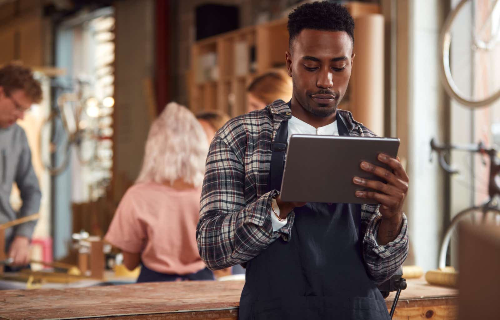 Business owner works on a tablet.