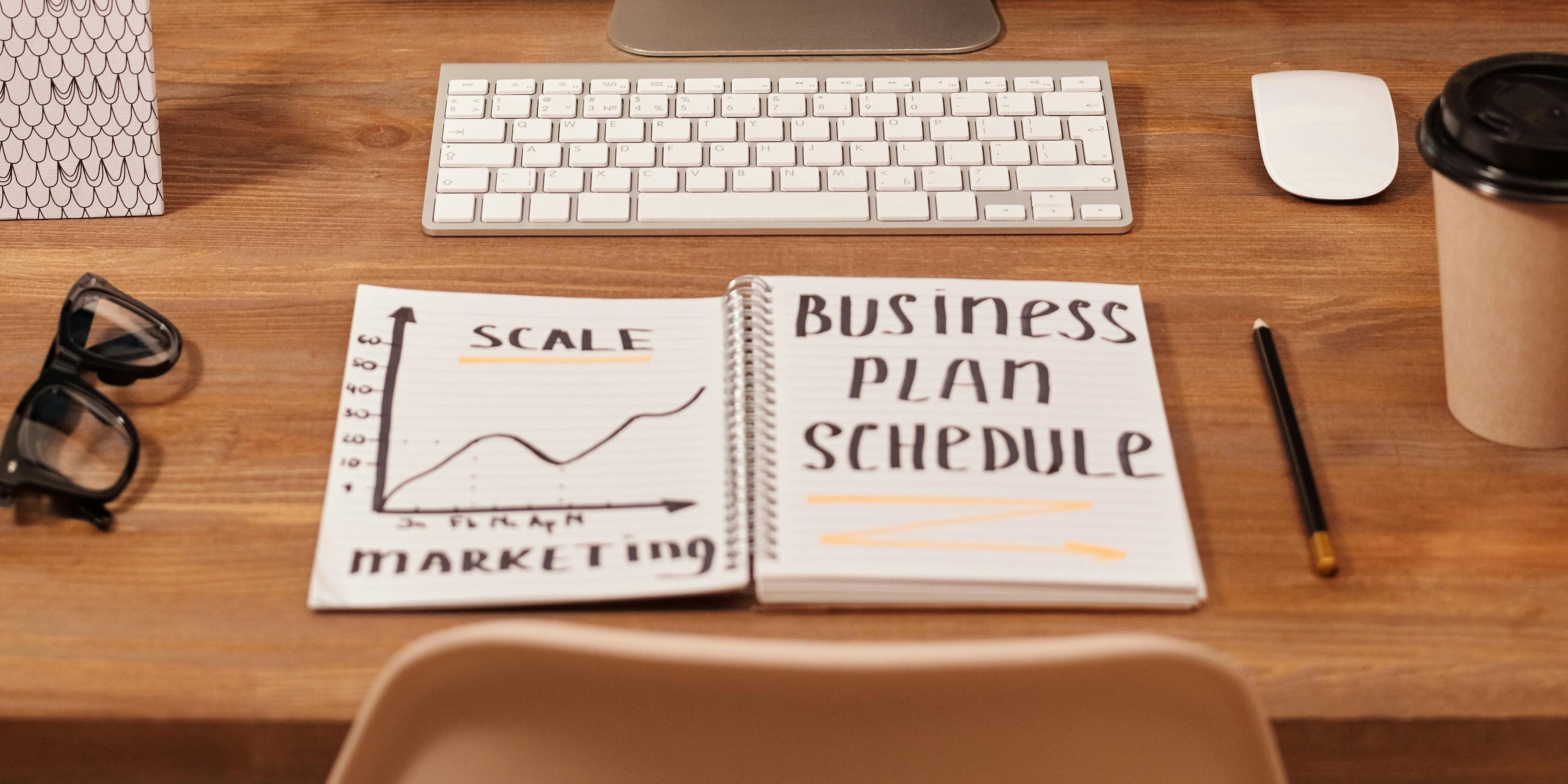 Business Plan Schedule Written on a Notebook