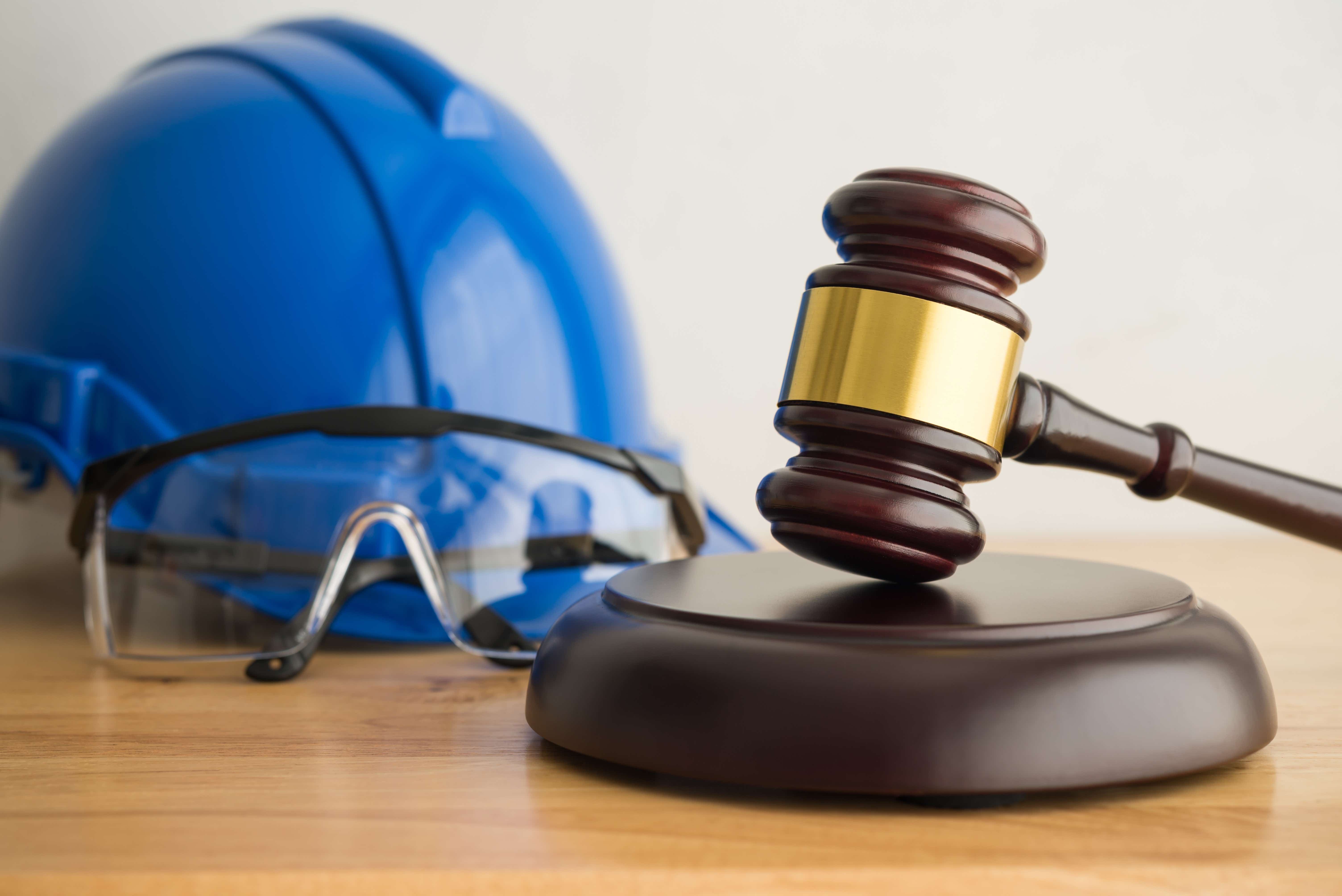 A worker's hard hat and a gavel