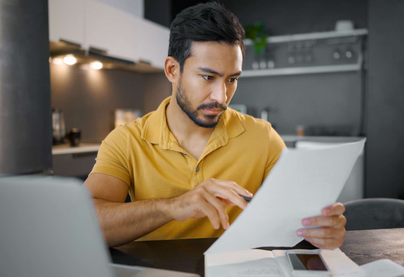 A businessman reviews his paperwork