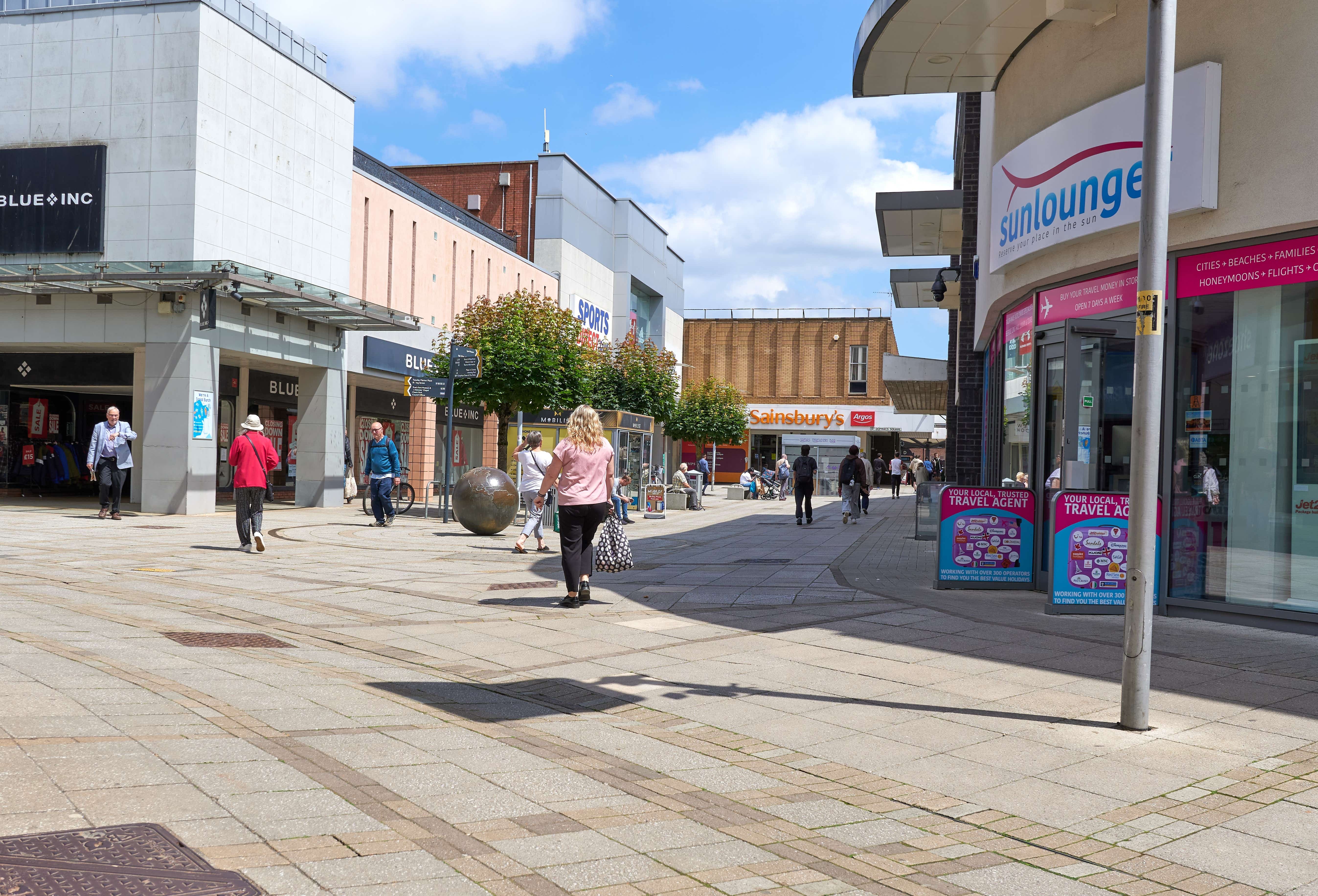 A British high street with a few shoppers