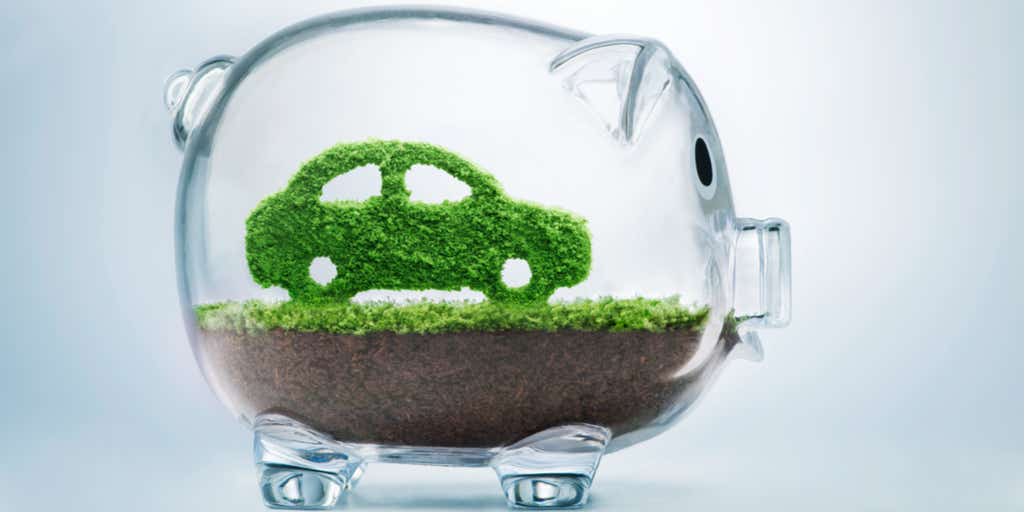 green car inside piggy bank