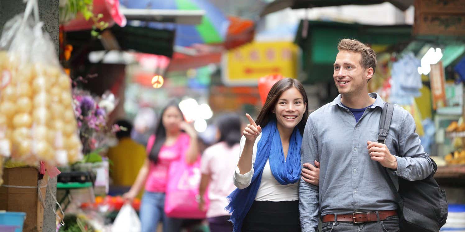 Happy couple shopping on holiday