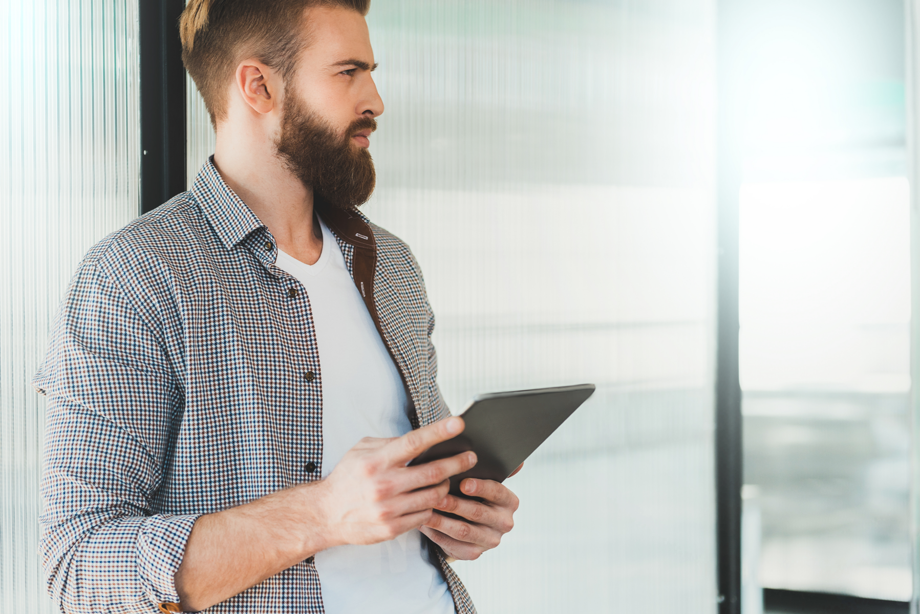 Thoughtful man with tablet
