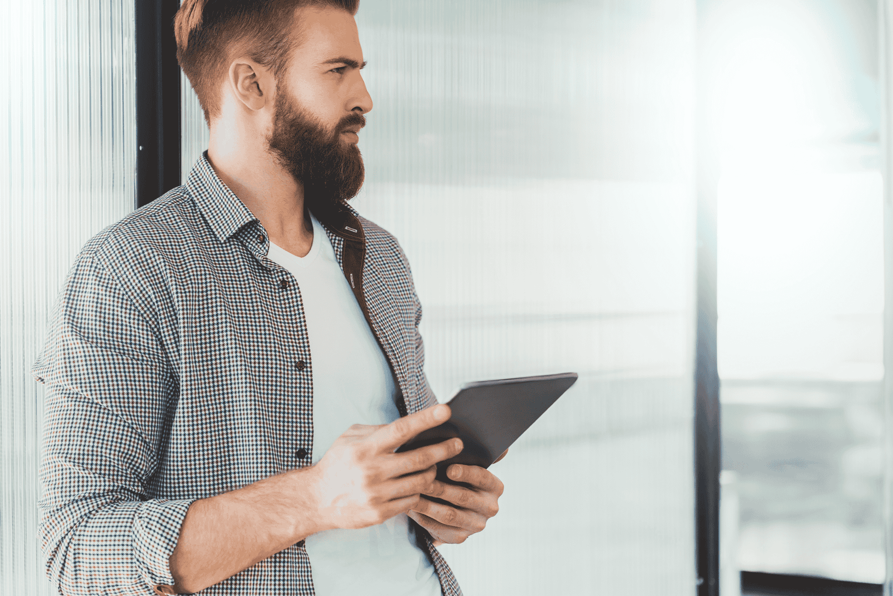 Thoughtful man with tablet