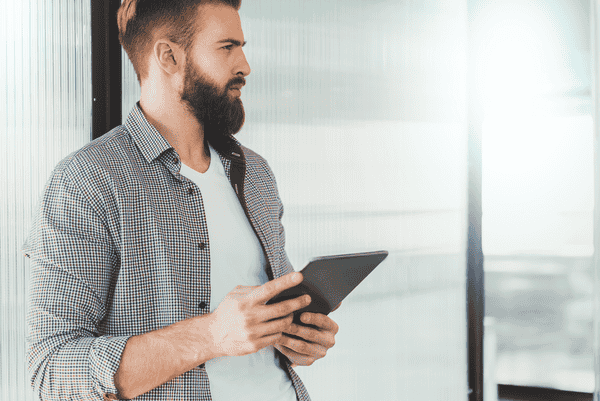Thoughtful man with tablet