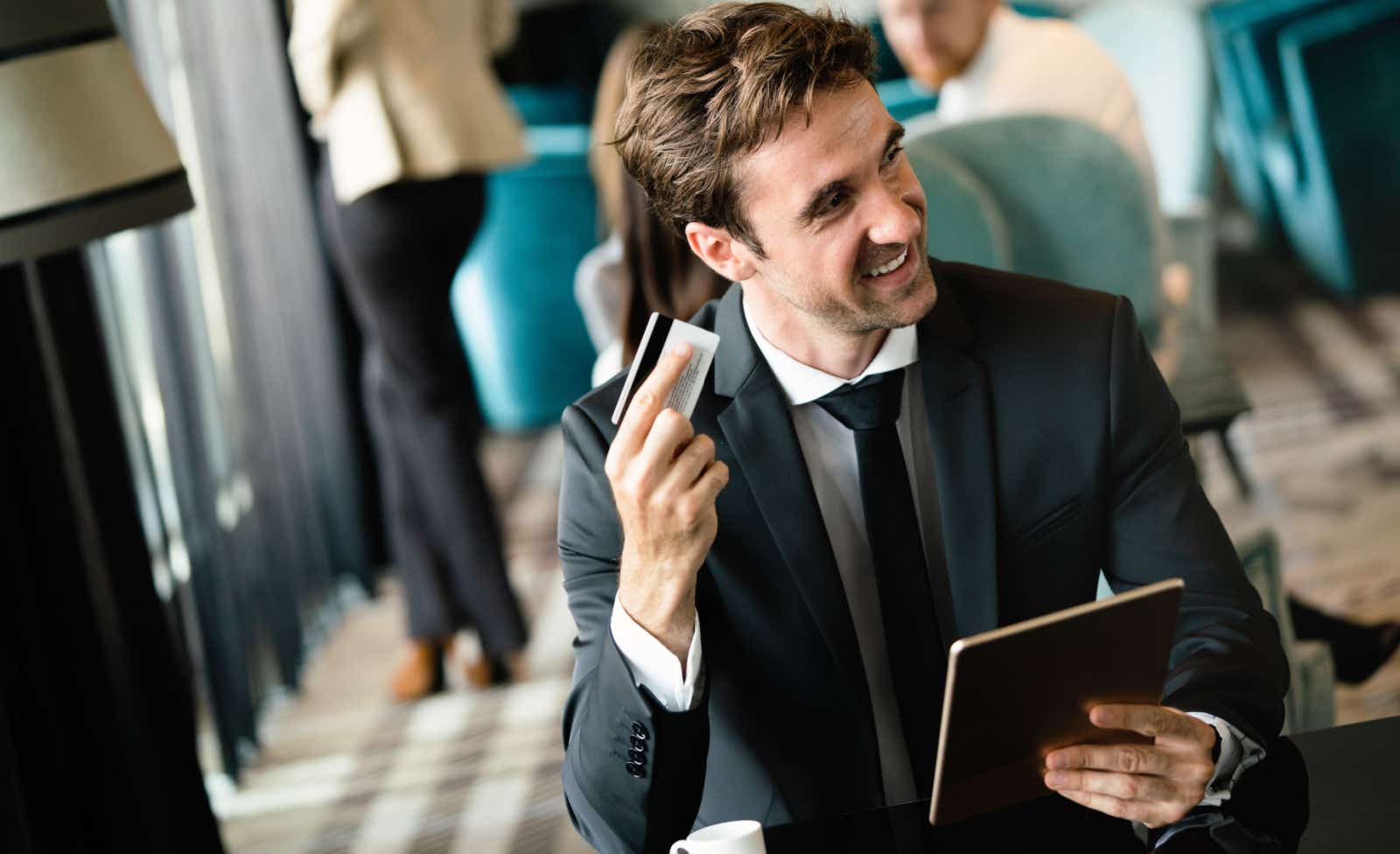 Businessman holding a credit card.