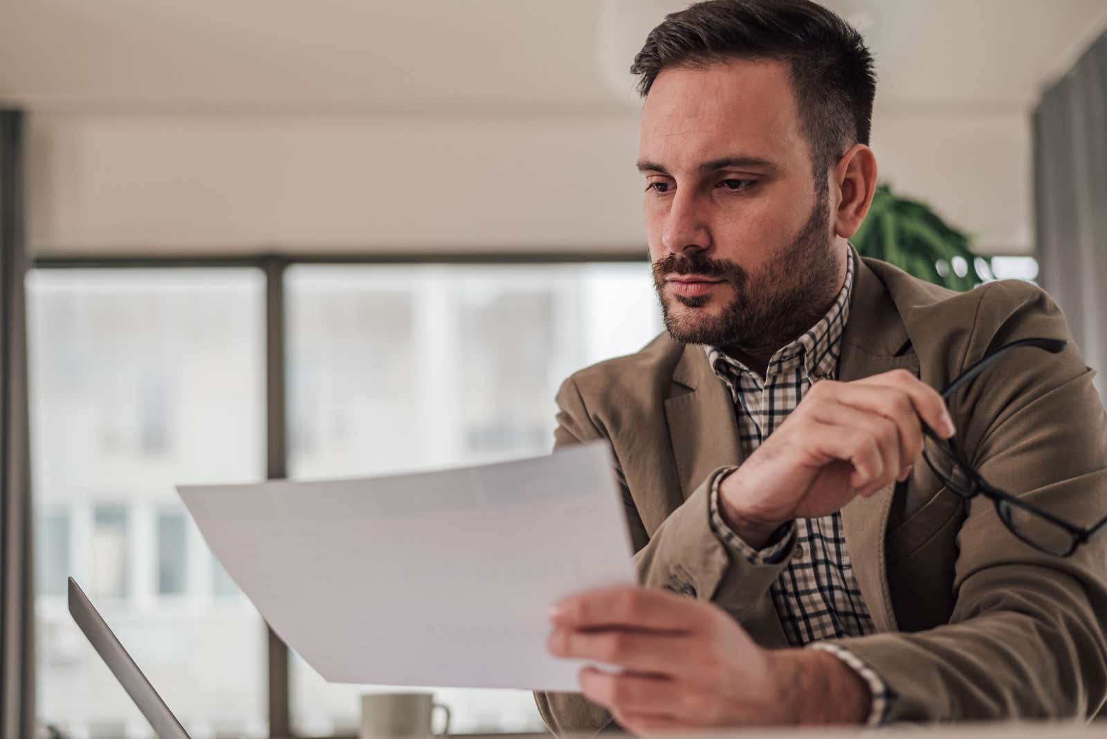 Businessman reviewing paperwork.